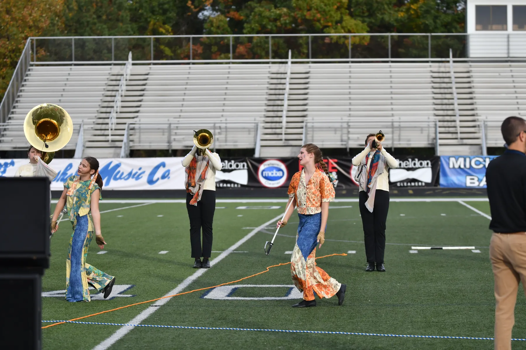 South Lyon High School Marching Band performs on the field