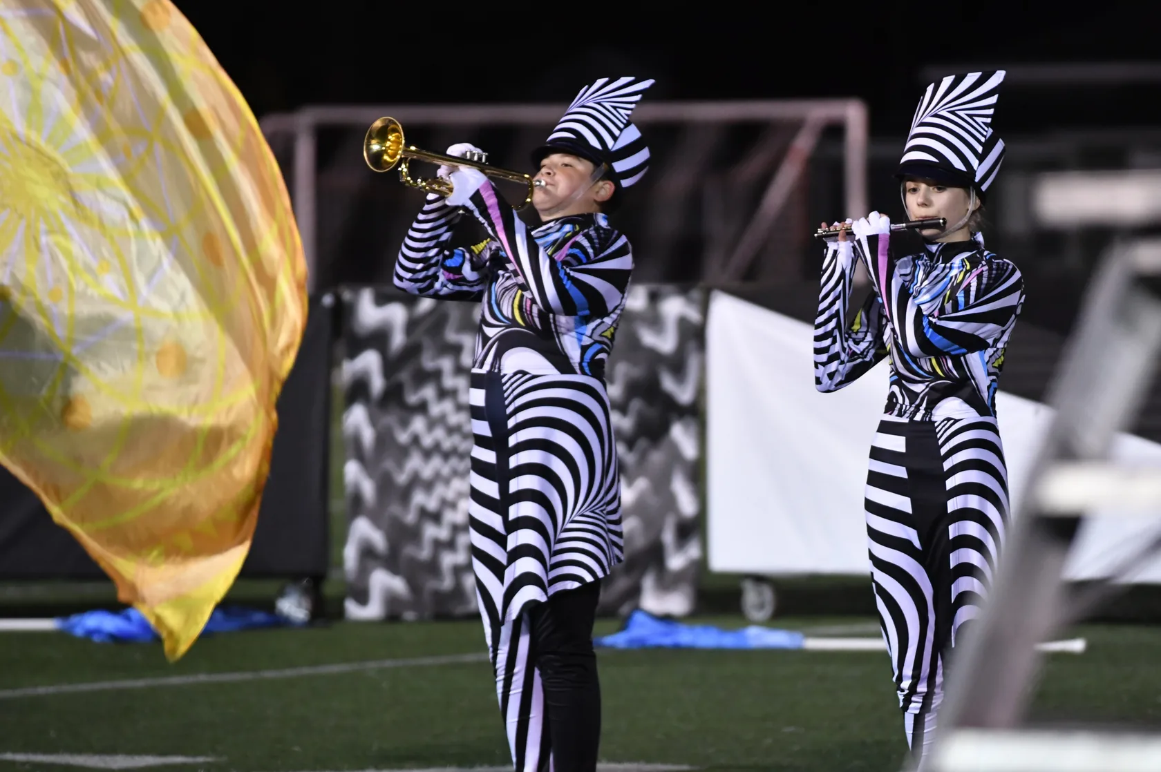 Two brass players performing in the 2025 marching-band show